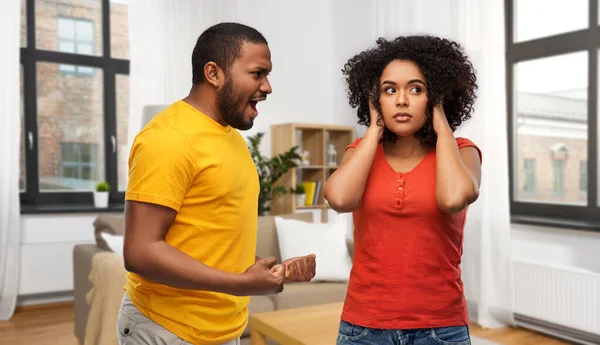 African american couple having argument at home — стокове фото