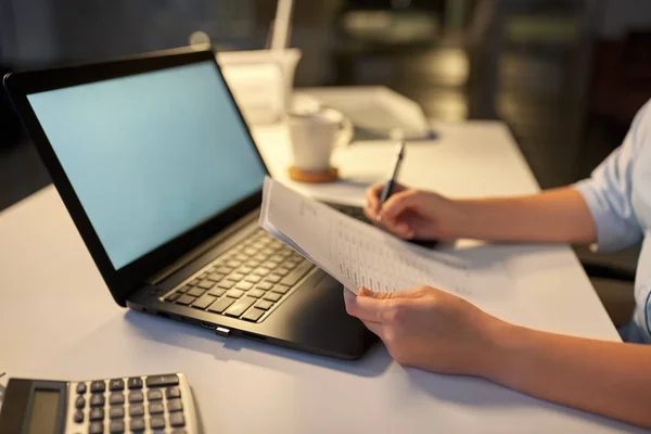 Businesswoman with papers working at night office — Stock Photo, Image