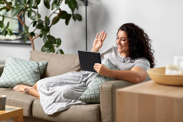 Woman with tablet pc having video chat at home — Stock Photo, Image