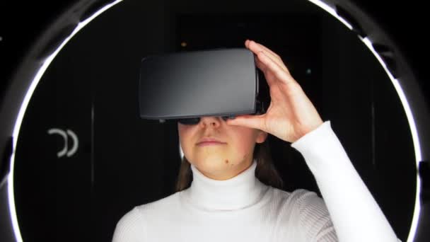 Woman in virtual reality headset or vr glasses — ストック動画