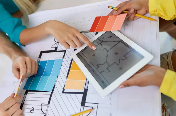 Close up of architects with blueprint on tablet pc — Stok fotoğraf