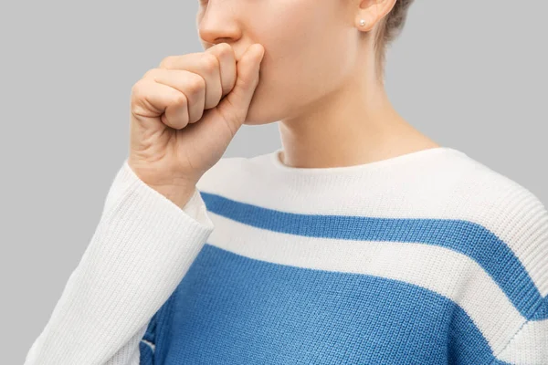 Sick coughing teenage girl in pullover — Zdjęcie stockowe