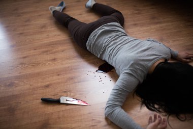 dead woman body lying on floor at crime scene clipart
