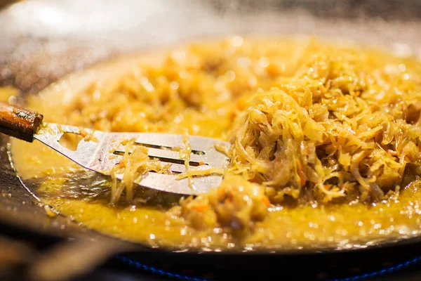Braised cabbage or sauerkraut in wok or frying pan — Stock Photo, Image