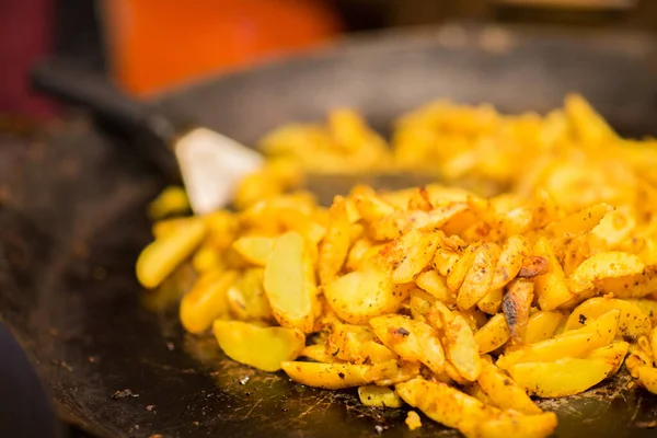 Fried potato on stir fry pan — Stock Photo, Image