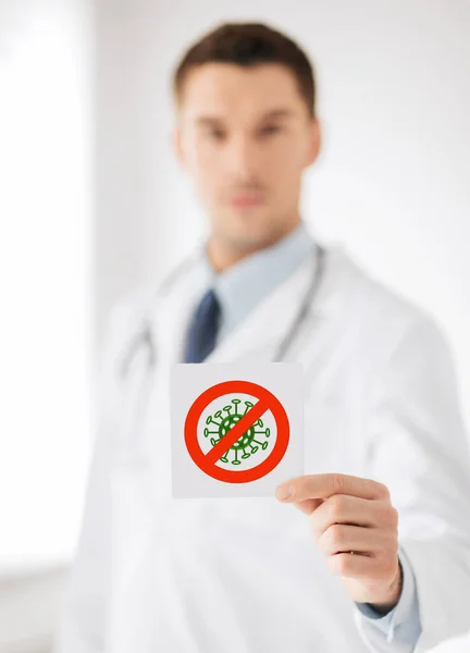 Male doctor holding coronavirus sign Stockafbeelding