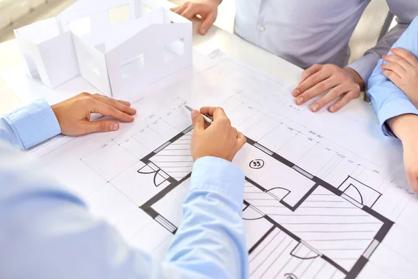 Close up of architects with blueprint at office — Stock Photo, Image