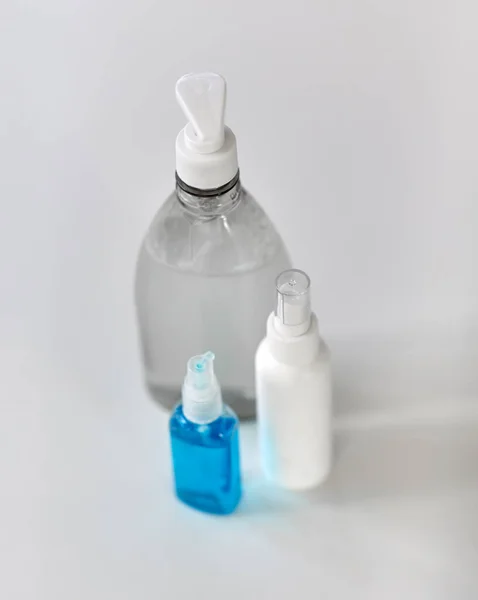 Close up of different hand sanitizers on table — Stock Photo, Image