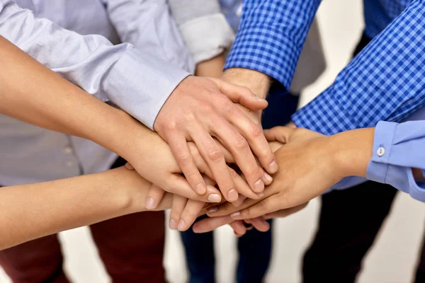 Close up of people stacking hands Royalty Free Stock Images