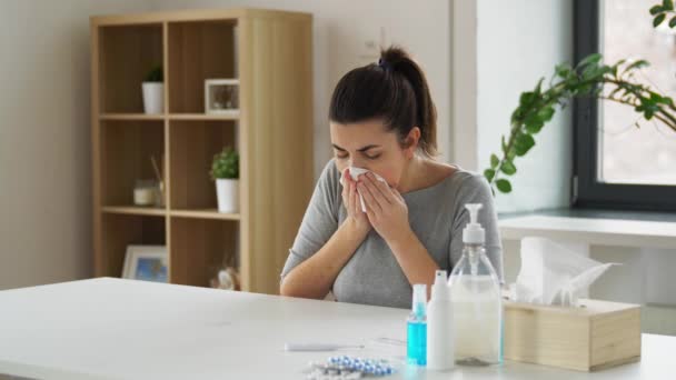 Sick woman with medicine coughing to paper tissue — Stock Video