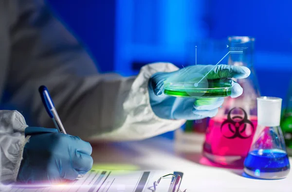 Scientist with tests writing report of biohazard — Stock Photo, Image