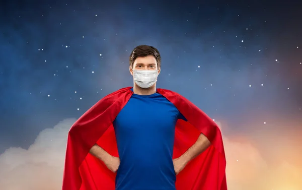 Superhero man in face protective mask at night — Stock Photo, Image