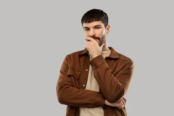 Portret van denkende jongeman met snorren — Stockfoto