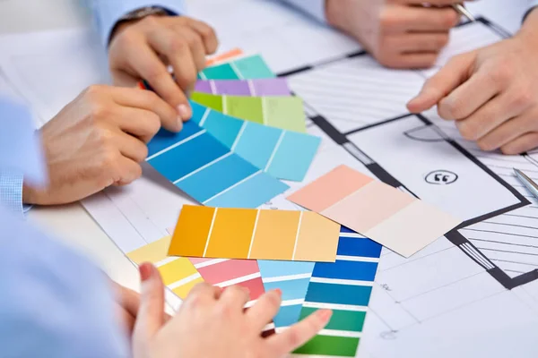 Close up of designers team working with blueprint — Stock Photo, Image