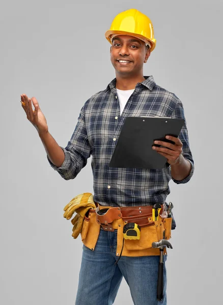 Happy indian builder in helmet with clipboard — Stock Photo, Image