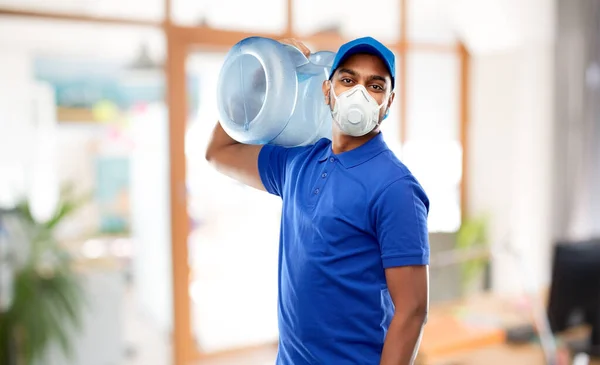 Delivery man with water barrel in respirator — Stock Photo, Image