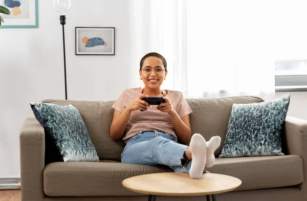 African american woman with gamepad playing game — Stock Photo, Image