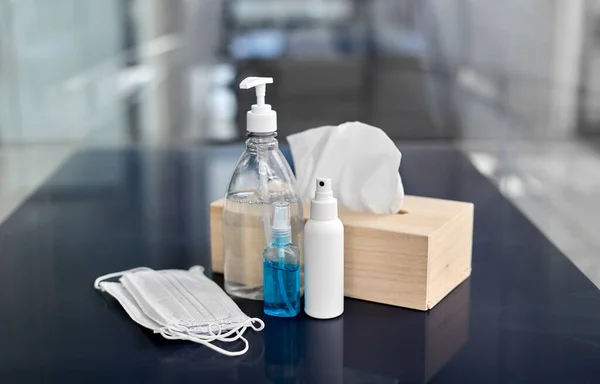 Hand sanitizers, masks, liquid soap and tissues — Stock Photo, Image