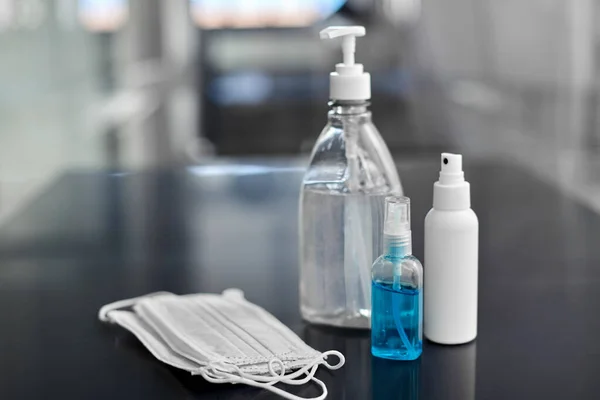 Hand sanitizers, medical masks and liquid soap — Stock Photo, Image