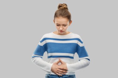 teenage girl having stomach ache clipart