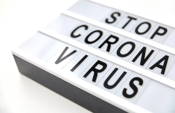 Close up of lightbox with stop corona virus words — Stok Foto