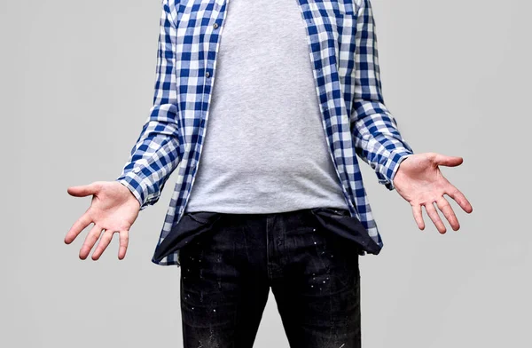 Close up of man showing empty pockets — Stock Photo, Image