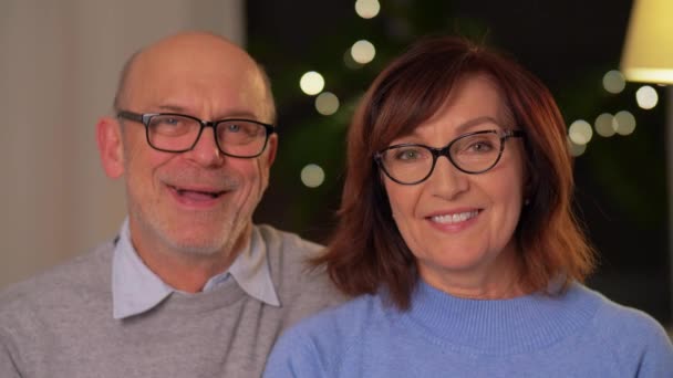 Portrait of happy senior couple at home in evening — Stockvideo