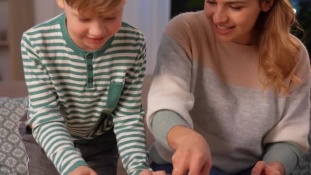 Mother and son playing with toy cars at home — 비디오
