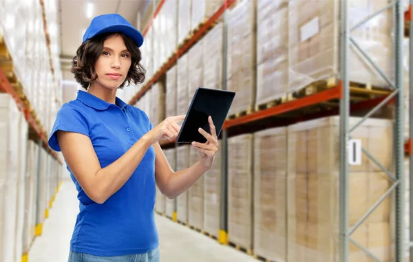 Delivery girl with tablet pc at warehouse — Stock Photo, Image