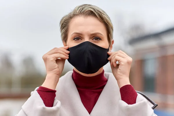 Woman wearing protective reusable barrier mask Royalty Free Stock Photos
