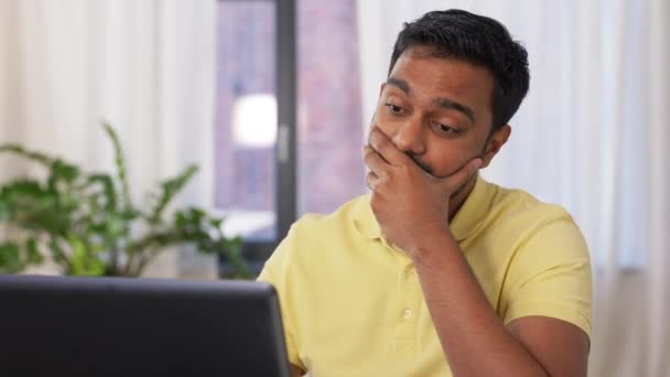 Indian man with laptop working at home office — Stock Video