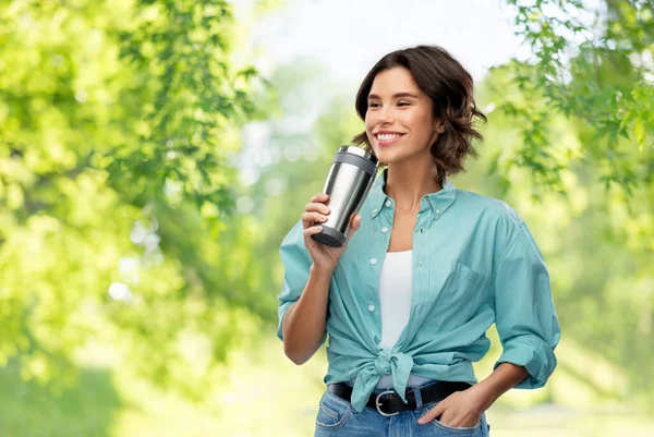 Woman drinking from thermo cup or tumbler — Stock Photo, Image