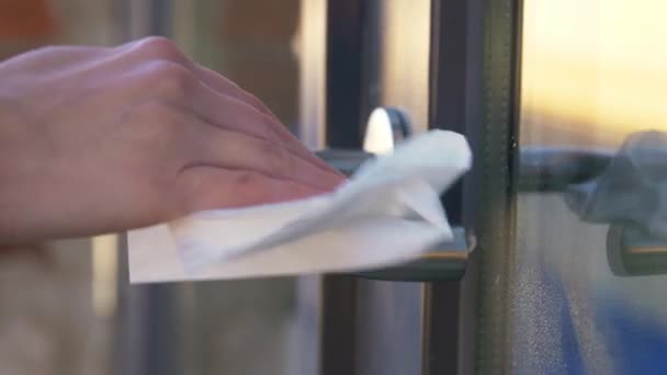 Hand cleaning doorhandle with disinfectant spray — Stock Video