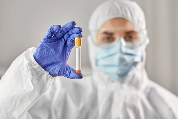 Scientist in protective mask with test tube — Stock Photo, Image