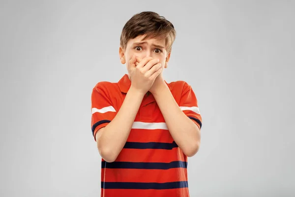 Scared boy clothing mouth with hands — Stock Photo, Image