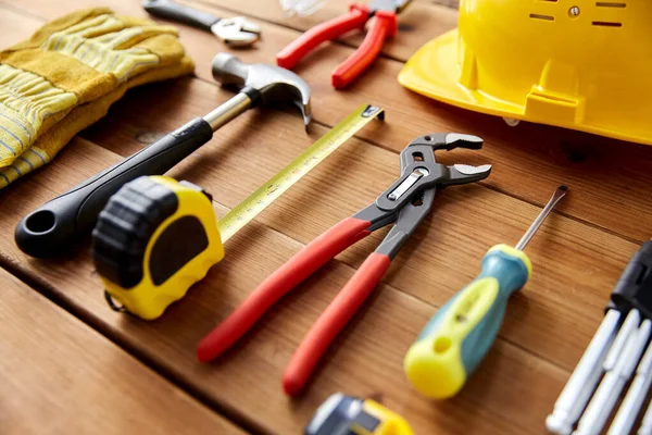 Different work tools on wooden boards — Stock Photo, Image