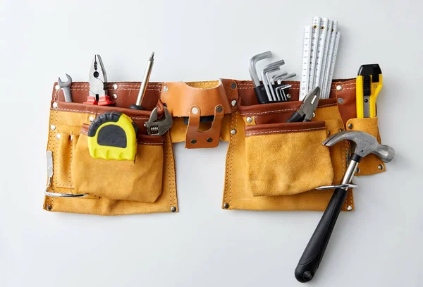 different work tools in belt on white background