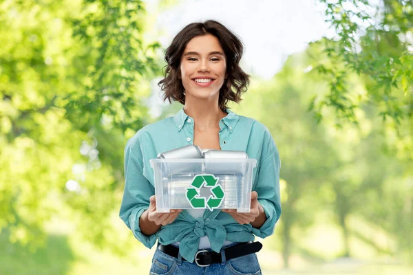 Smiling young woman sorting metallic waste — Stock Photo, Image