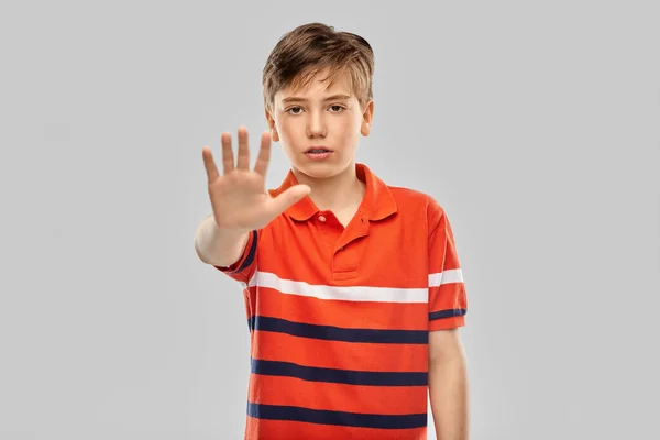 Portrait of boy making stopping gesture — Stock Photo, Image