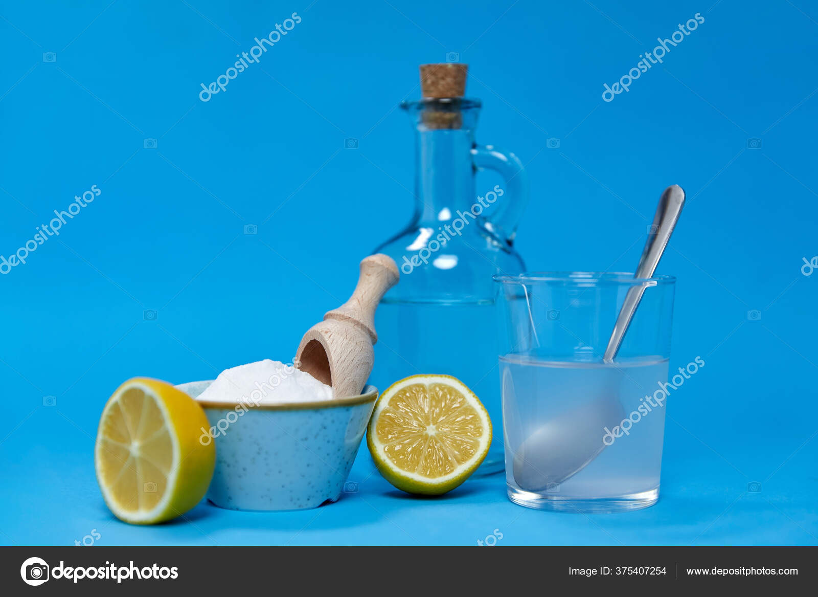 Lemons, washing soda, bottle of vinegar and glass Stock Photo by  ©Syda_Productions 375407254