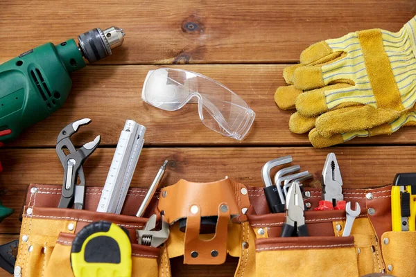 Different work tools on wooden boards — Stock Photo, Image