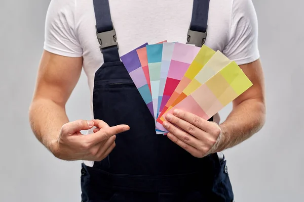 Close up of painter with color charts Royalty Free Stock Photos