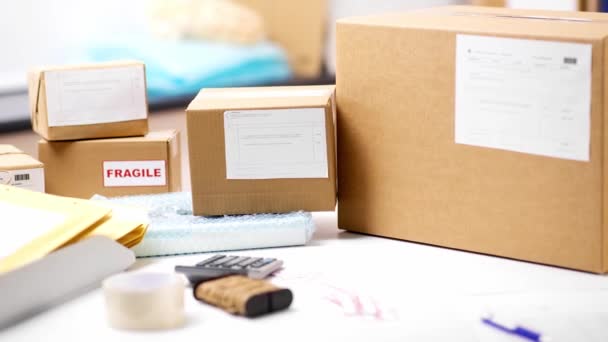 Parcel boxes on table at post office — Stockvideo