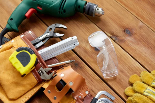 Different work tools on wooden boards — Stock Photo, Image