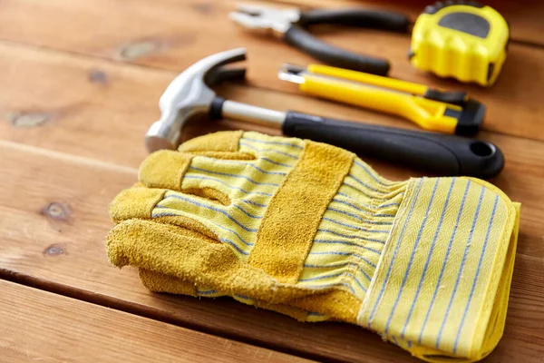 Different work tools on wooden boards — Stock Photo, Image