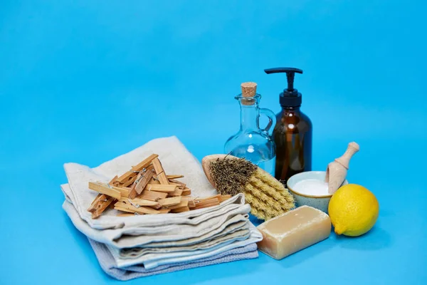 baking soda, lemon, brush, vinegar and clothespins