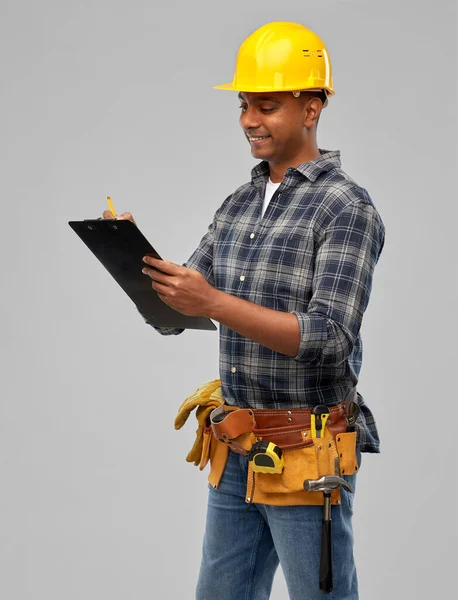 Thinking builder with clipboard and pencil — Stock Photo, Image