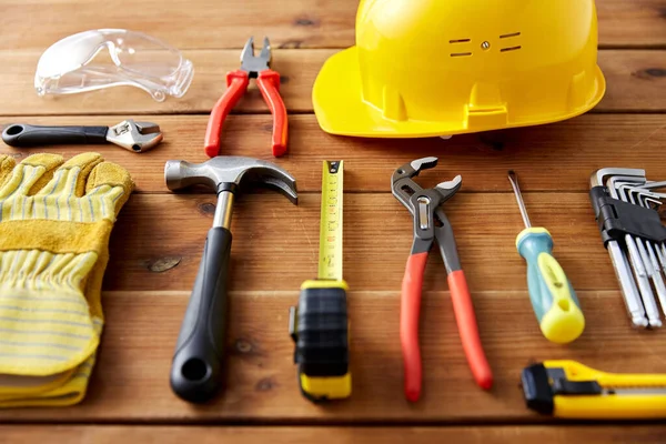 Different work tools on wooden boards — Stock Photo, Image