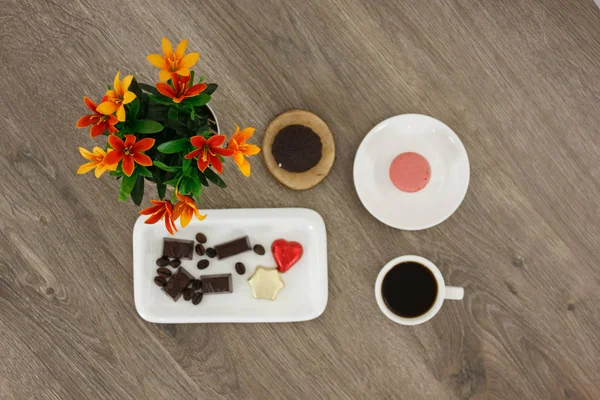 top view spinning video of coffee cup with candies and flowers