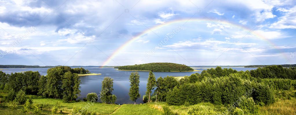 Rainbow in summer over lake in Belarus